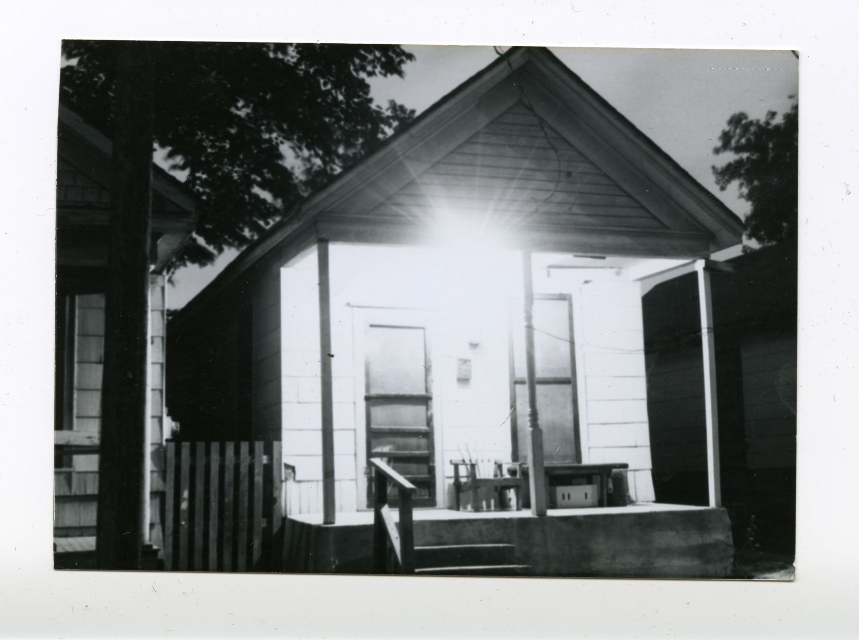Bungalow with a bright porch light in Freedmen's Town